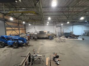 pano with 37 , genie, wills truck, shear etc.